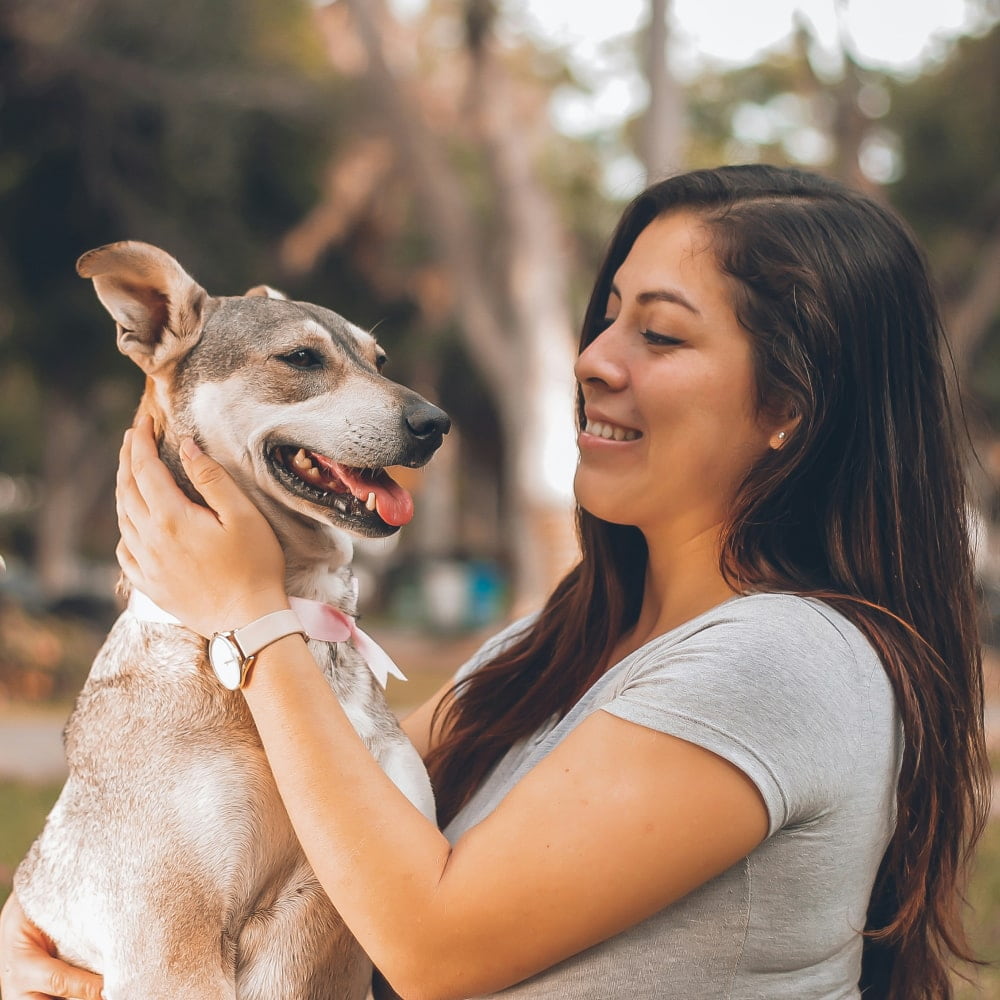 Women playing with her dog