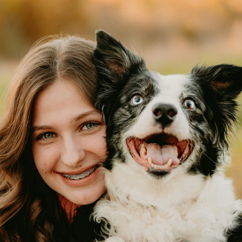 Happy girl with her happy dog
